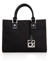 Dress it up or dress it down, this Calvin Klein tote can easily take you from a day at the office to drinks on the town. Shiny silvertone hardware and a signature charm add the perfect amount of polish to this look.