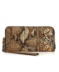 An eye-catching design from Kenneth Cole Reaction, featuring a fun python print and sleek metallic accents. An easy-access zip-around closure and convenient wristlet strap add function to this fashion-loving design.