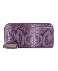 Showcasing python embossed in cool hues, this sleek ziparound clutch from Kenneth Cole New York seamlessly marries fashion and function. 12 card slots inside!