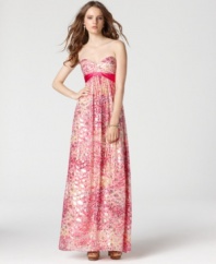 BCBGMAXAZRIA's maxi dress is made of a sumptuous silk blend for a luxe feel. A bright print is emboldened with flecks of metallic detail, adding flashes of drama to the silhouette.