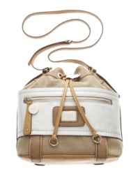 Take the GUESS work out of great style with this trend-right drawstring bag by GUESS. A casual canvas exterior combines with patent detailing and polished pale goldtone hardware for a look you'll want to rock all season long.