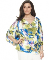 Punch up your style with J Jones New York's butterfly sleeve plus size top, finished by a draped neckline and vibrant print.