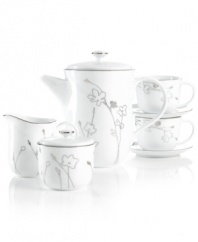 Wildflowers gleam in polished platinum, adding whimsical glow to the Silhouette tea set. A banded edge adds a classic touch to serveware, cups and saucers with modern spirit.