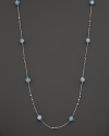 This sterling silver necklace, gleaming with aquamarine, makes an elegant statement. By Di MODOLO.