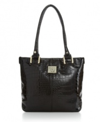 Rectangular goldtone hardware and a glossy finish lend this elegant croc shopper from AK Anne Klein a luxe look.