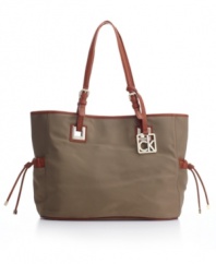 A new casual classic: The roomy nylon purse by Calvin Klein totes it all, workweek or weekend.