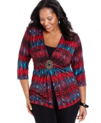 Be a fashionable standout with Elementz' three-quarter sleeve plus size top, accented by a striking medallion!