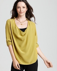 Fluttering silk charmeuse is splashed with bold color and styled into this flowing Eileen Fisher drape front top.