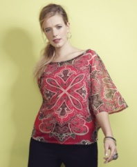 Stand out this season with INC's batwing sleeve plus size top, featuring a beaded neckline and spirited print.