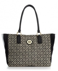 The quintessential signature jacquard logo tote by Tommy Hilfiger is elegantly versatile for carrying all your essentials. This polished piece features pretty goldtone hardware details for a touch of class.