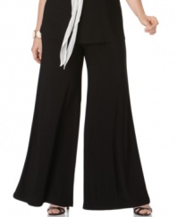 A flare-leg silhouette creates a dramatic look on elegant matte jersey plus size pants from Onyx.