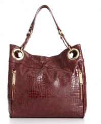 Glossy goldtone grommets and vertical zips embellish this boldly chic croc-embossed patent tote from Steve Madden.