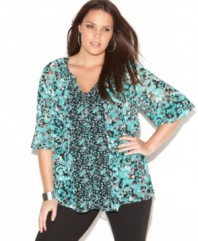 Refresh your casual look with INC's three-quarter sleeve plus size top, highlighted by a mixed floral print.
