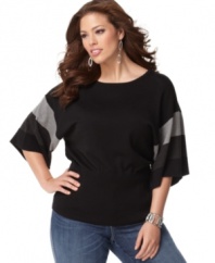 Catch onto the colorblocked trend with Cable & Gauge's short sleeve plus size sweater, finished by a banded hem.