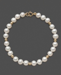 The perfect strand of pearls for a special little girl. This children's bracelet features cultured freshwater pearls (5-6 mm) and 14k gold bead accents in a 14k gold setting. Approximate length: 6 inches.
