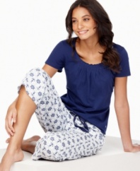 Anchors aweigh! Sail off to sleep with the fun, printed capri pants and cute t-shirt by Nautica.