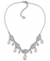 The perfect accessory for your big day. Carolee's lovely bridal necklace stuns with glass pearl drops and sparkling glass and plastic accents. Set in silver tone mixed metal. Approximate length: 16 inches + 2-inch extender. Approximate drops: 5/8 inch.