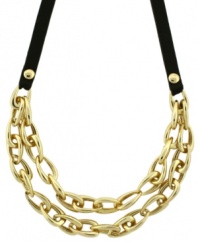 Streetwise style. Crafted in a chic combination of gold tone mixed metal and black leather, Vince Camuto's double chain link necklace will make a striking impact each time you wear it. Approximate length: 18 inches.