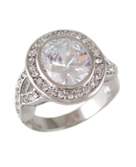 Put on the glitz in this ultra-glam design. Head-turning ring by City by City features dozens of round-cut crystals surrounding a bezel-set crystal center stone. Set in silver tone mixed metal. Size 7 and 8.