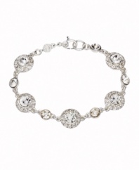 A little sparkle takes your look a long way. Monet bracelet features round-cut cubic ziconias surrounded by halos of cubic zirconia accents. Crafted in silver tone mixed metal. Approximate length: 7-1/2 inches.
