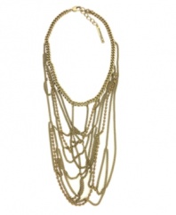 Go for the gold. Add attitude to your style with BCBGeneration's striking swagger necklace. Embellished with sparkling topaz glass accents, it's made in gold tone mixed metal and includes a toggle closure. Approximate length: 17 inches. Approximate drop: 6 inches.