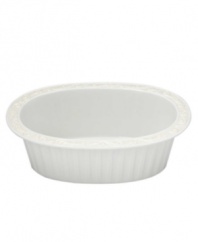 This pristine white serveware features gently scalloped rims and raised patterns of cascading vines. Perfect for casual dining or formal entertaining, this charming oval baker is sure to enhance mealtime at your home. Can go from freezer to oven! From Lenox's dinnerware and dishes collection. Qualifies for Rebate