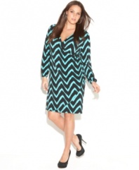 A faux wrap design lends a flattering shape to INC's long sleeve plus size dress, featuring a vibrant print-- wear it from day to play! (Clearance)