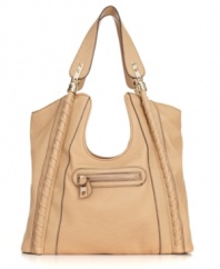 This unique tote from Jessica Simpson will make you do a double take! Beautiful piped trim, polished goldtone hardware and an eye-catching cut-out middle decorate this fabulous bag for a subtle notice-me style.