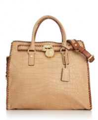 This stunning design by MICHAEL Michael Kors puts a modern spin on the classic satchel. Crocodile print leather, whipstitch detailing and polished goldtone accents make this gorgeous style ideal for business or pleasure.