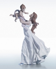 A beautifully detailed evocation of a connection that goes beyond words. This figurine is crafted of fine porcelain, delicate painted hues, and a high gloss finish, so exquisite you can just about feel the cool breeze against your skin. Measures 18.5 x 11.5.