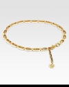 Glossy resin links accented with radiant goldtone details and an iconic logo charm. Width, about 1Imported 