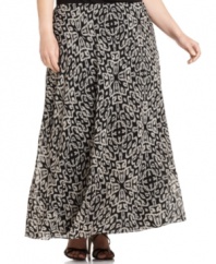 Take your career style to new lengths with DKNYC's printed plus size maxi skirt, defined by a flattering A-line shape.
