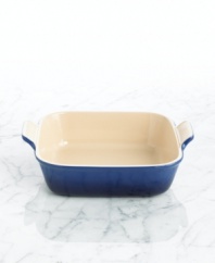 Straight from the oven to the table, this stoneware baker is built odor-, scratch- and stain-resistant, gracefully taking wear and tear in and out of the kitchen for a lifetime of use. The deep dish is ideal for layered entrees and desserts, but also offers more than function with a refined design and flared handles that give it centerpiece status. 5-year limited warranty.