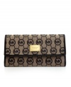 Whether you're jetting off to Rio or running errands around town, this luxe little lovely from MICHAEL Michael Kors is the perfect companion. The exterior is dressed to impress in signature jacquard and glam 18k gold hardware, while the interior is all about organization with separate checkbook holder, plenty of pockets and even a place for your favorite pen.
