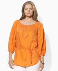 A gracefully smocked neckline and bold floral embroidery impart boho-chic style to this plus size Lauren by Ralph Lauren tunic in light-as-air linen.
