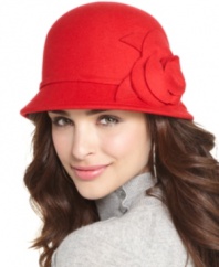 Petal perfect. Bring a touch of warm weather to a chilly day with this flower-adorned wool cloche by Nine West.