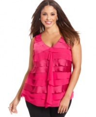 A ruffled front lends romantic appeal to Alfani's sleeveless plus size top-- dress it up with trousers or down with denim.