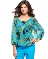Jones New York Signature's petite top features a bright print on a sheer material, creating a stunning blouse! Pair with colored capris for an on-trend look. (Clearance)