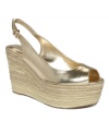 Golden goddess. Perfect for warm-weather glamour, the Rueman wedges by GUESS feature a slingback silhouette atop an espadrille wedge heel.