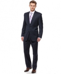 Keeps your wardrobe on the cutting edge with this slim-fit navy suit from Calvin Klein.