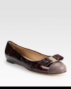 Luminous patent leather flat fronted by a logoed bow and exotic, textured leather toecap. Patent leather and printed leather upperLeather lining and solePadded insoleMade in Italy
