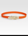 Be bold and whimsical with this elastic style accented with a shiny metal buckle and tip. Width, about 1Made in Italy
