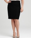 A simple Eileen Fisher skirt lends versatility to workday style with a sleek, slim silhouette. A fold-over waist updates the look for a modern finish.
