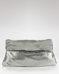 Rock a heavy metal with this sequin clutch from BCBGMAXAZRIA. Boasting an easy-to-wear fold over shape, this bag shines with every evening look.