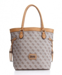 The scandal would be to leave it home! With GUESS's signature quatrefois G monogram print, side drawstrings and a tall, elegant size that's the right size for shopping, this chic carryall will be your go-to bag.