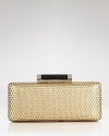 In perforated leather, this clutch from DIANE von FURSTENBERG has '70's-inspired flair. Maximize the retro-shape with a halter neck dress and towering heels.