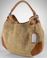 Designed for bohemian chic in a slouchy hobo silhouette, the Claridge from Lauren by Ralph Lauren embodies effortless style and is crafted from woven paper straw offset with luxe leather detailing.