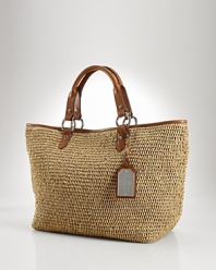 With a classic shape and rich details, this woven tote from Lauren Ralph Lauren epitomizes low-key luxury. Ideally sized for the vacation essentials, this style is set for your next jet jaunt.