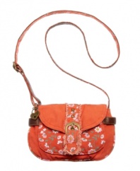 Pretty floral detailing adds a femme charm to this easy-going crossbody from American Rag. This adorable style features lightly distressed details and a fun heart detail at handle base.