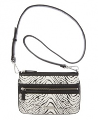 Twice as nice. The nylon crossbody purse by Calvin Klein transforms into a sleek modern clutch.